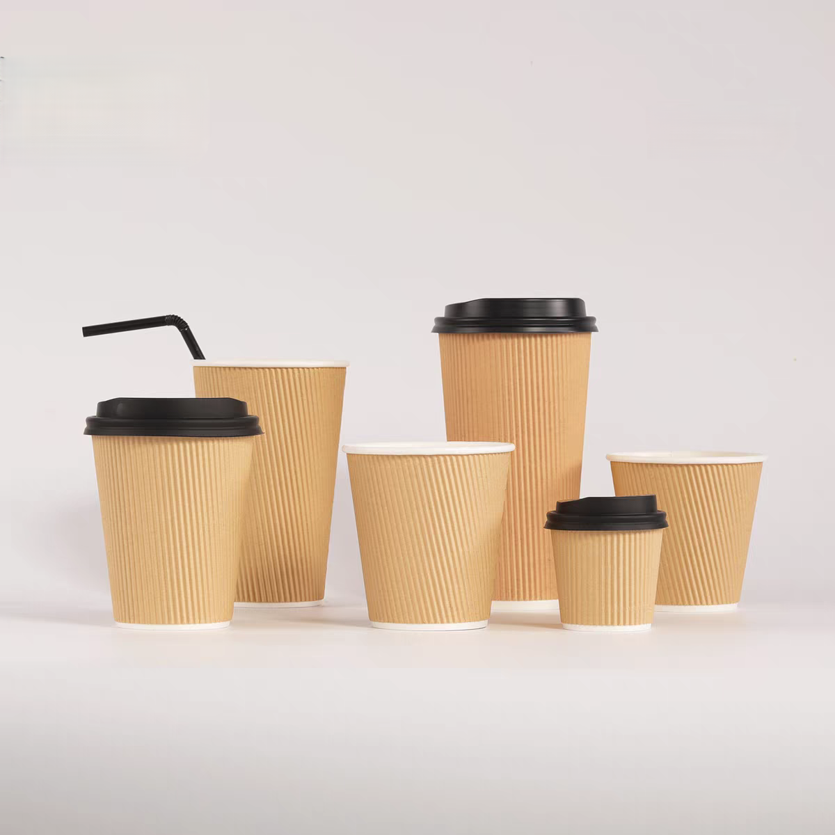 Different sizes brown Ripple Wall paper cups with black plastic lids